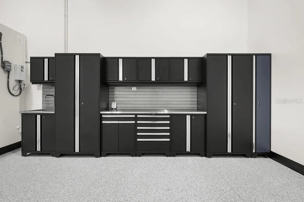 New Age™ Performance Series cabinetry system with stainless work sink that conveys