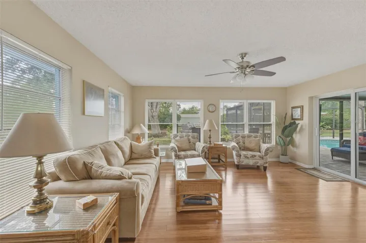 WOW! - Here is more space - Rear Family Room with access to the lanai-pool, and private back yard.
