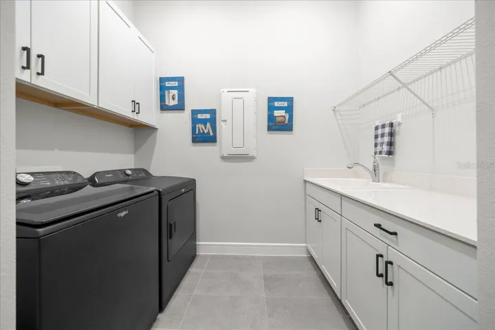Laundry Room with Cabinets and Sink