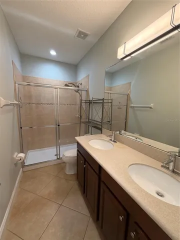 Master Bathroom complete with dual sinks and walk-in shower