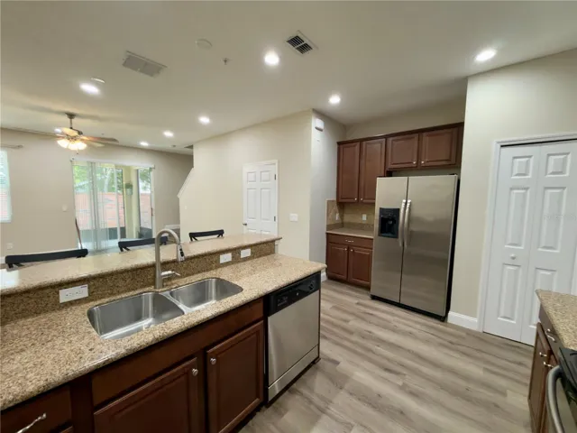 Large kitchen with stainless appliances