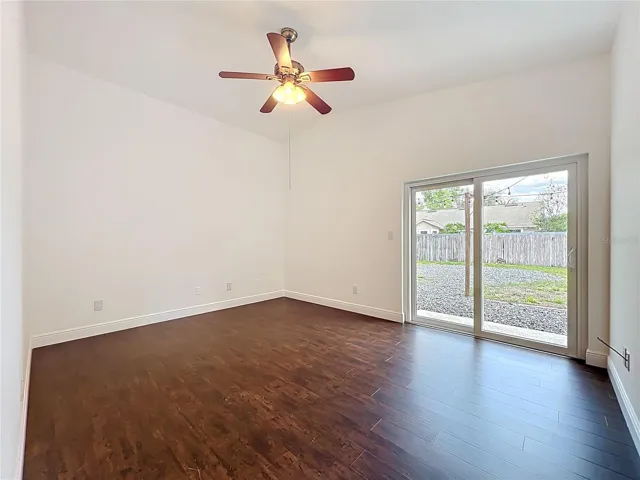 primary bedroom with sliding glass doors to backyard