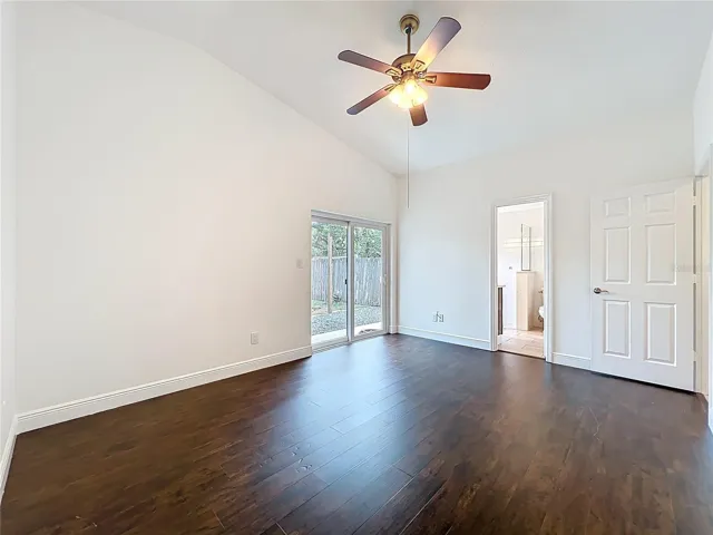 primary bedroom with sliding glass doors to backyard
