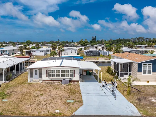 Well priced doublewide manufactured home on BOATABLE WATER WITH A POOL!