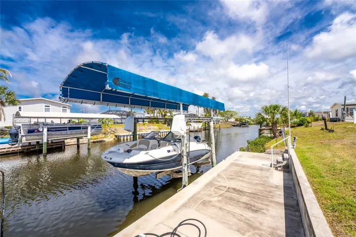 Concrete apron and boat lift with cover