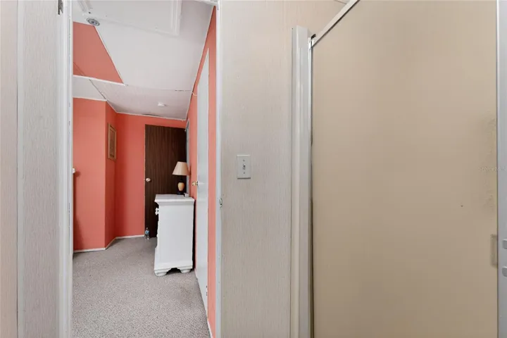 Shower is separate from the toilet and vanity in the primary bedroom