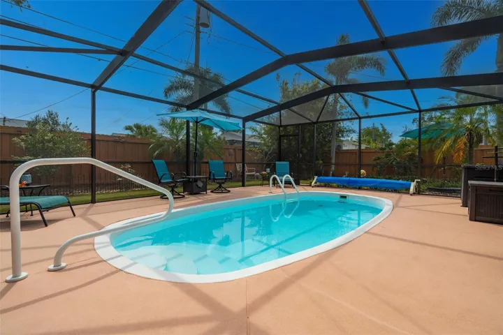 Pool with screen enclosure.