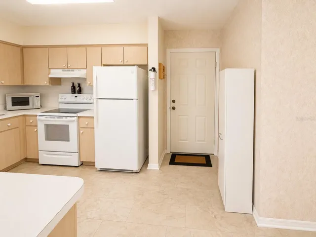Kitchen, door leads into garage