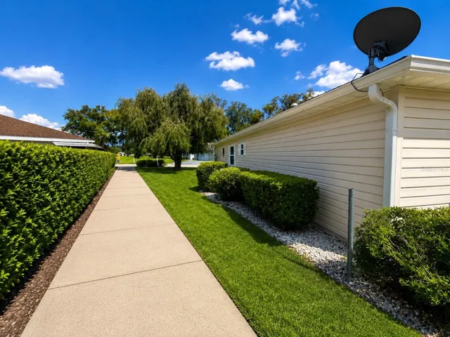 Side of house, with golf cart path