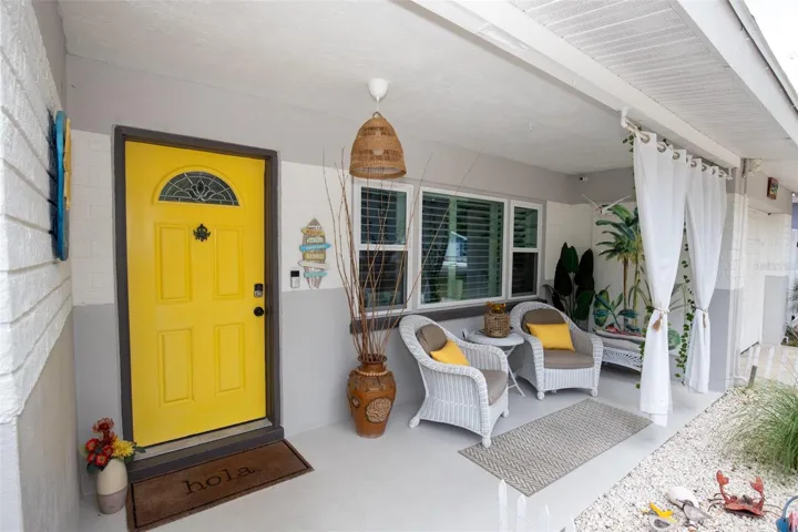 Covered porch ideal for morning coffee or evening drinks
