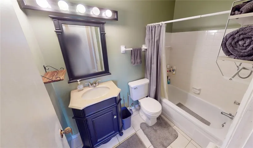 Guest bathroom with tub with shower