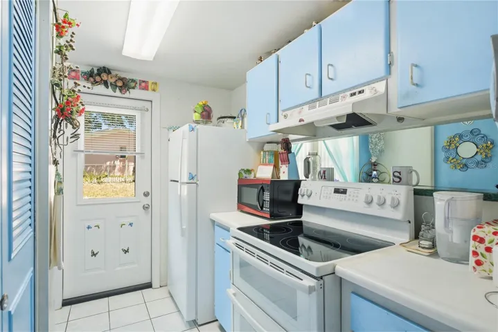 Kitchen has pass through and access to back yard!