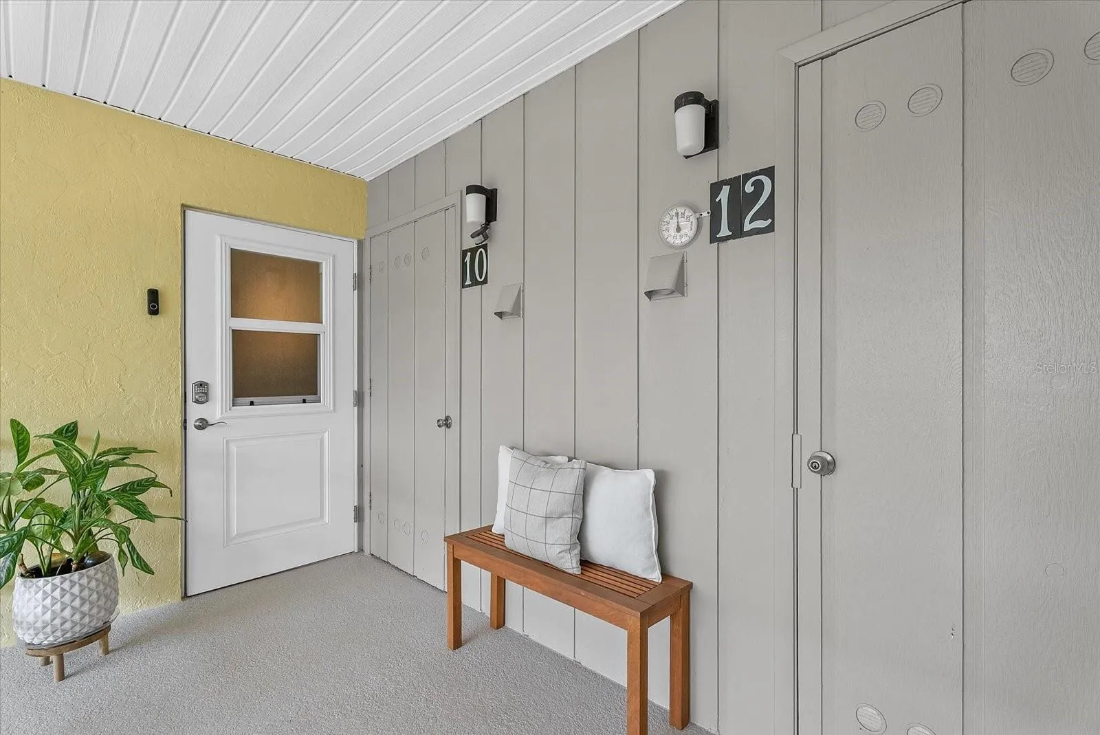 Welcoming front door with private laundry and storage