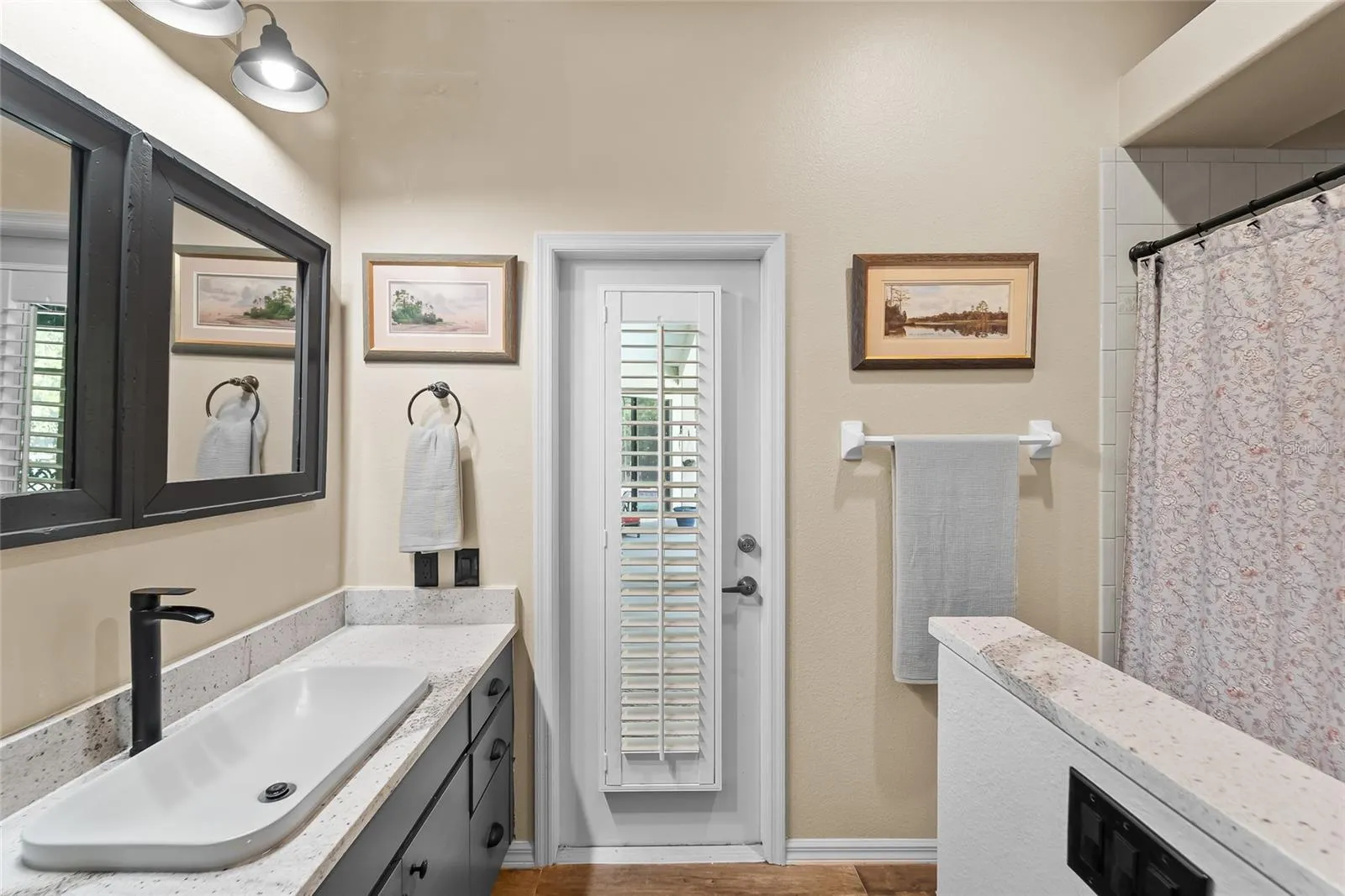 Guest bathroom has door to pool area