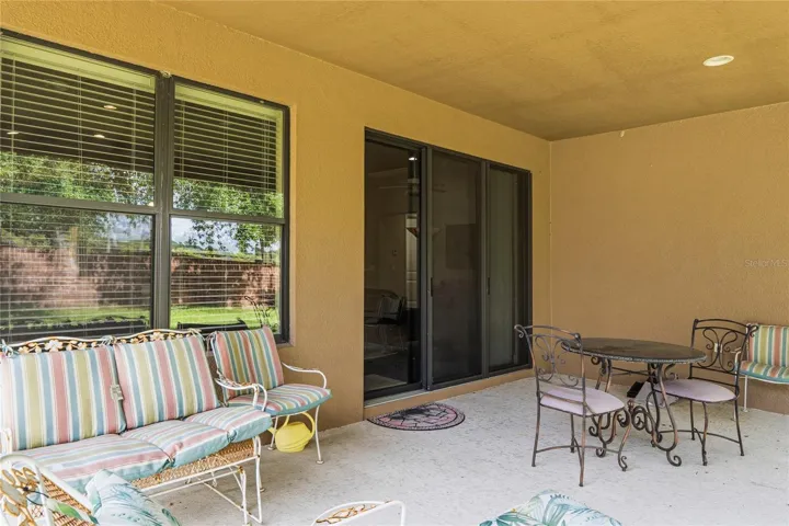 21x15 covered porch.  Triple sliders for access