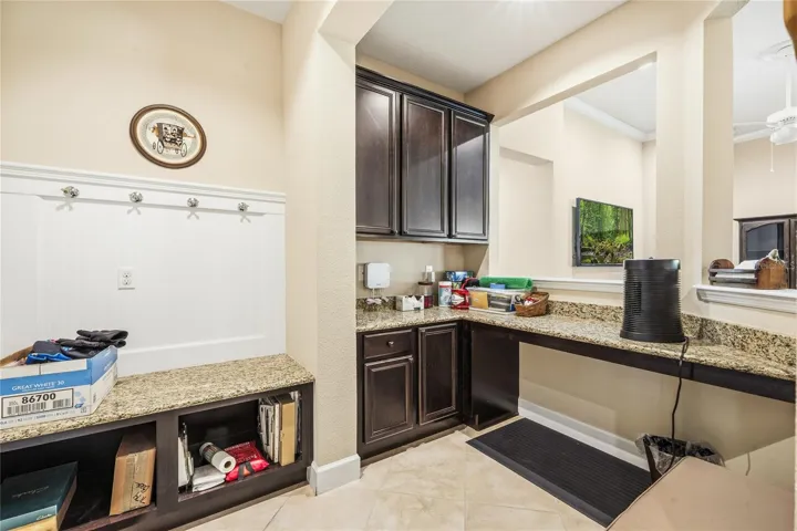 This room is listed as a studio. You can see it could be a desk area, dry bar, storage area, butler pantry etc.