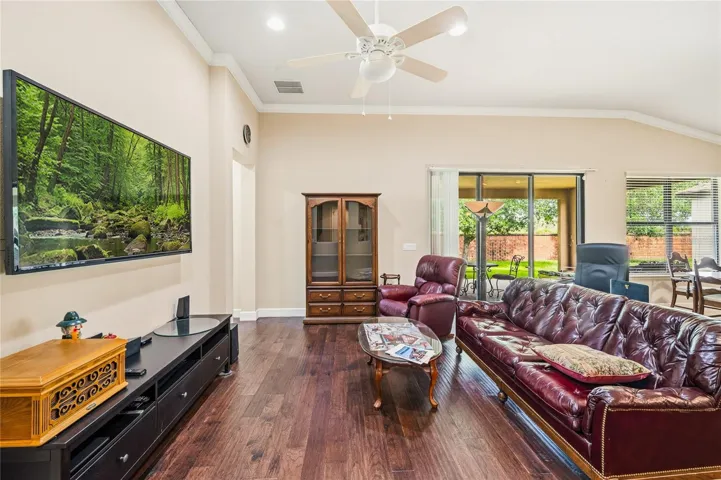 Family room, opening on the left leads to the Primary and two other bedrooms.