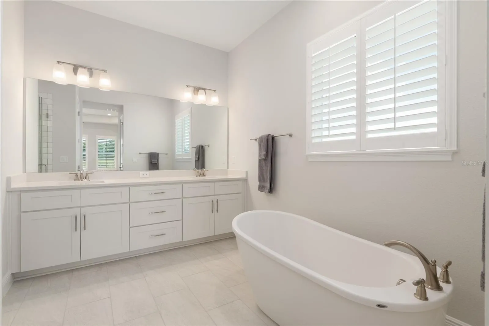 Double vanity and soaking tub.