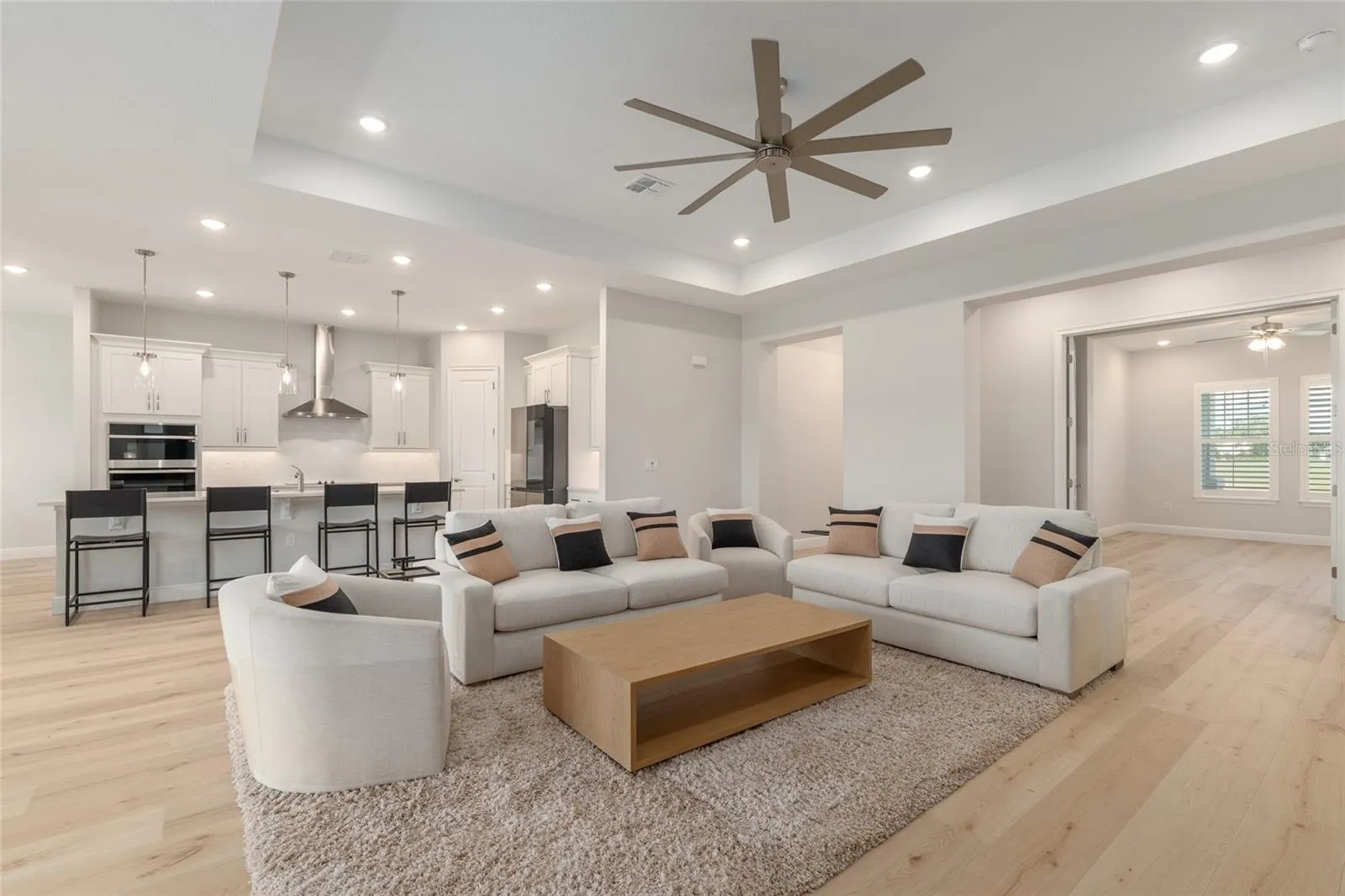 Beautiful tray ceiling and oversized ceiling fan.