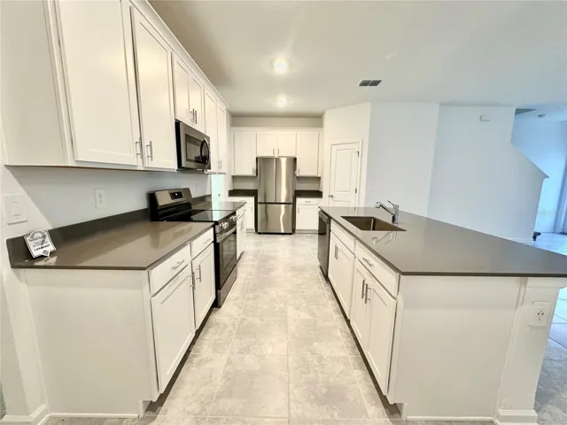 Many Cabinets and beautiful Countertops