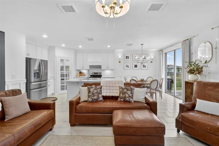 Open floor plan connecting living room to kitchen and dining area