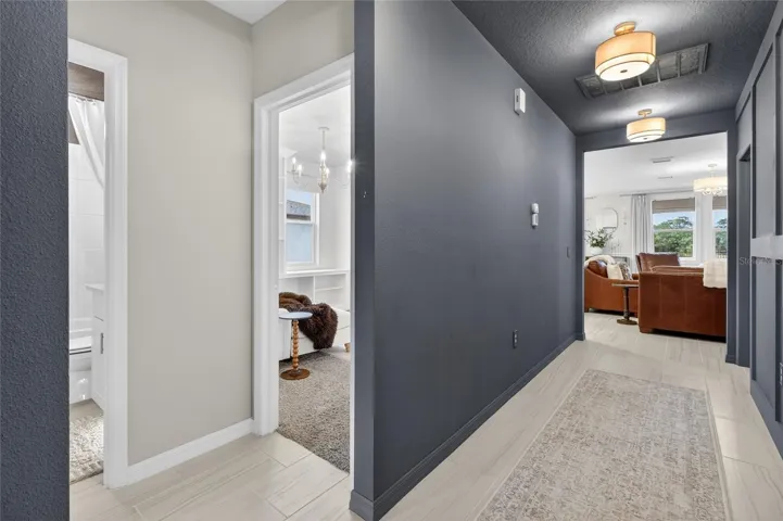 Foyer view with hallway leading to additional bedrooms & bathroom