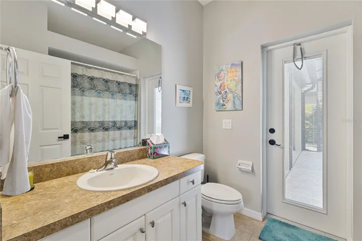 Guest bathroom flexes as a pool bath. Pool owners can appreciate this value.
