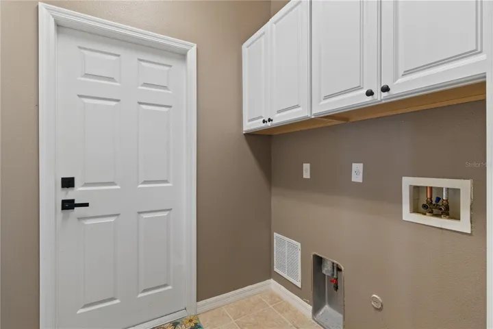 Laundry room with cabinet storage