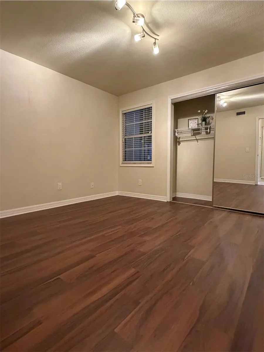 The second bedroom is 11x11 and has a large closet with full-length mirror doors.