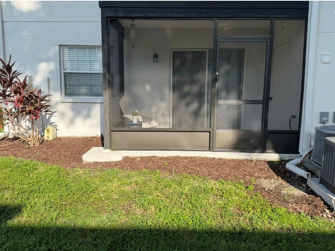 BRAND NEW Screened-in Patio installed August 2026!  Fresh mulch was laid, and there's a utility closet off the porch as well as a hose and spigot.