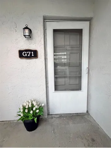Welcome to G71....Fresh flowers and been planted, and there's a storm door for extra protection and natural light or breeze when desired.