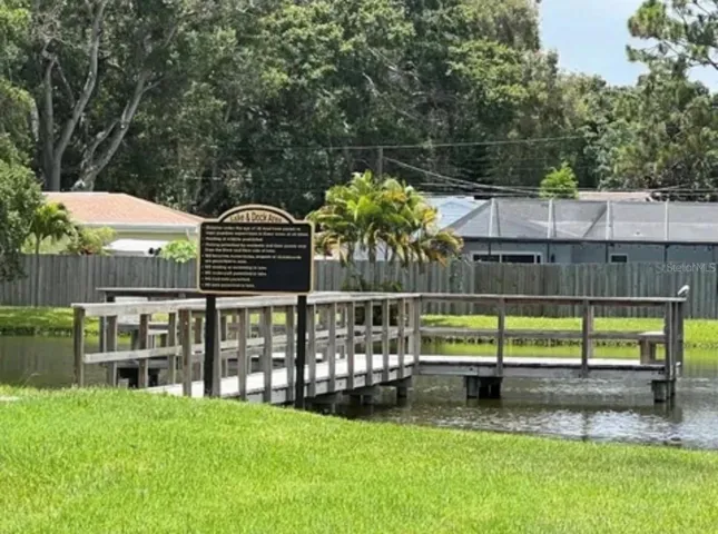 Enjoy the beautiful lake in the back of the community with a dock and seating areas.  Fishing is permitted.