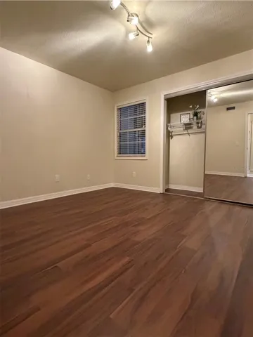 The second bedroom is 11x11 and has a large closet with full-length mirror doors.