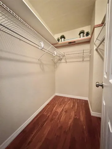 The primary walk-in closet is large.