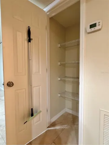 A hallway storage closet or pantry.