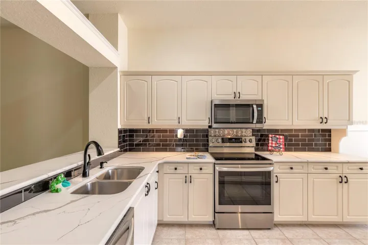Good size upgraded kitchen with stainless steel appliances and granite counter tops