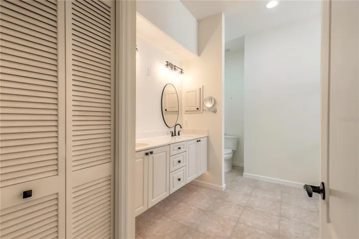 Beautiful primary bathroom with double sinks and step down shower
