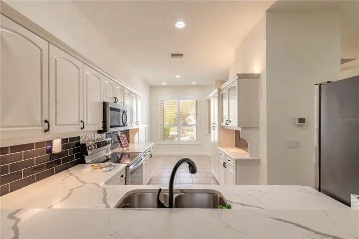 Good size upgraded kitchen with stainless steel appliances and granite counter tops
