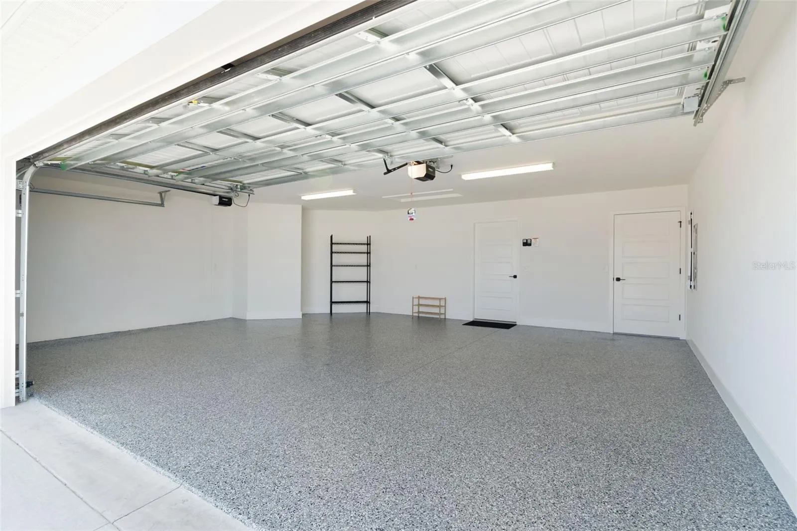 2 car + golf cart parking in garage. Shark Coated flooring