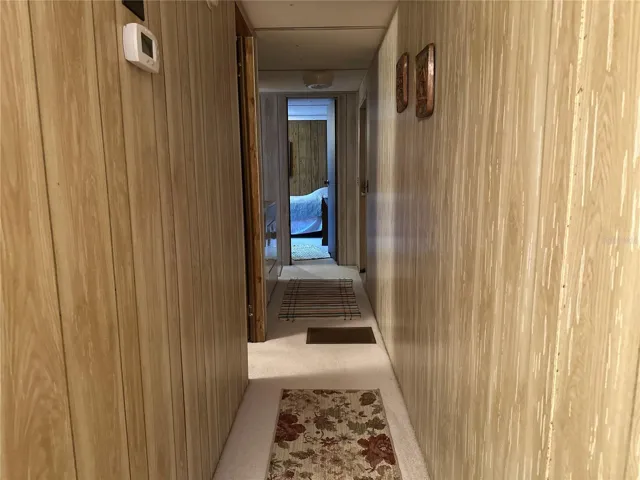 Hallway from dining room leads to 2nd and 3rd bedroom, 2nd bathroom and laundry area