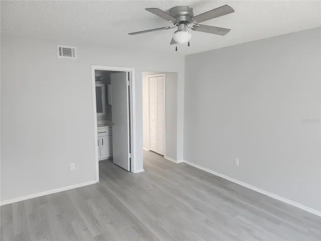 Primary bedroom on first floor with full bathroom