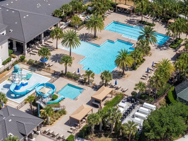 Aerial view of 3 pools, slide, and splash playground