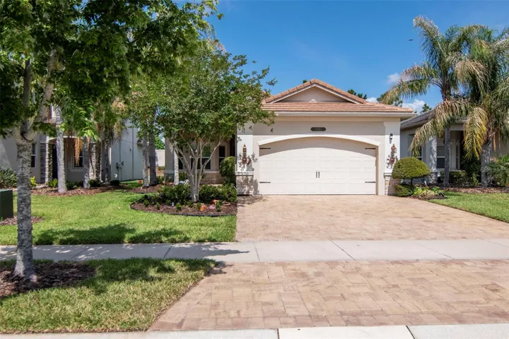 Elegant front elevation with extended paver driveway