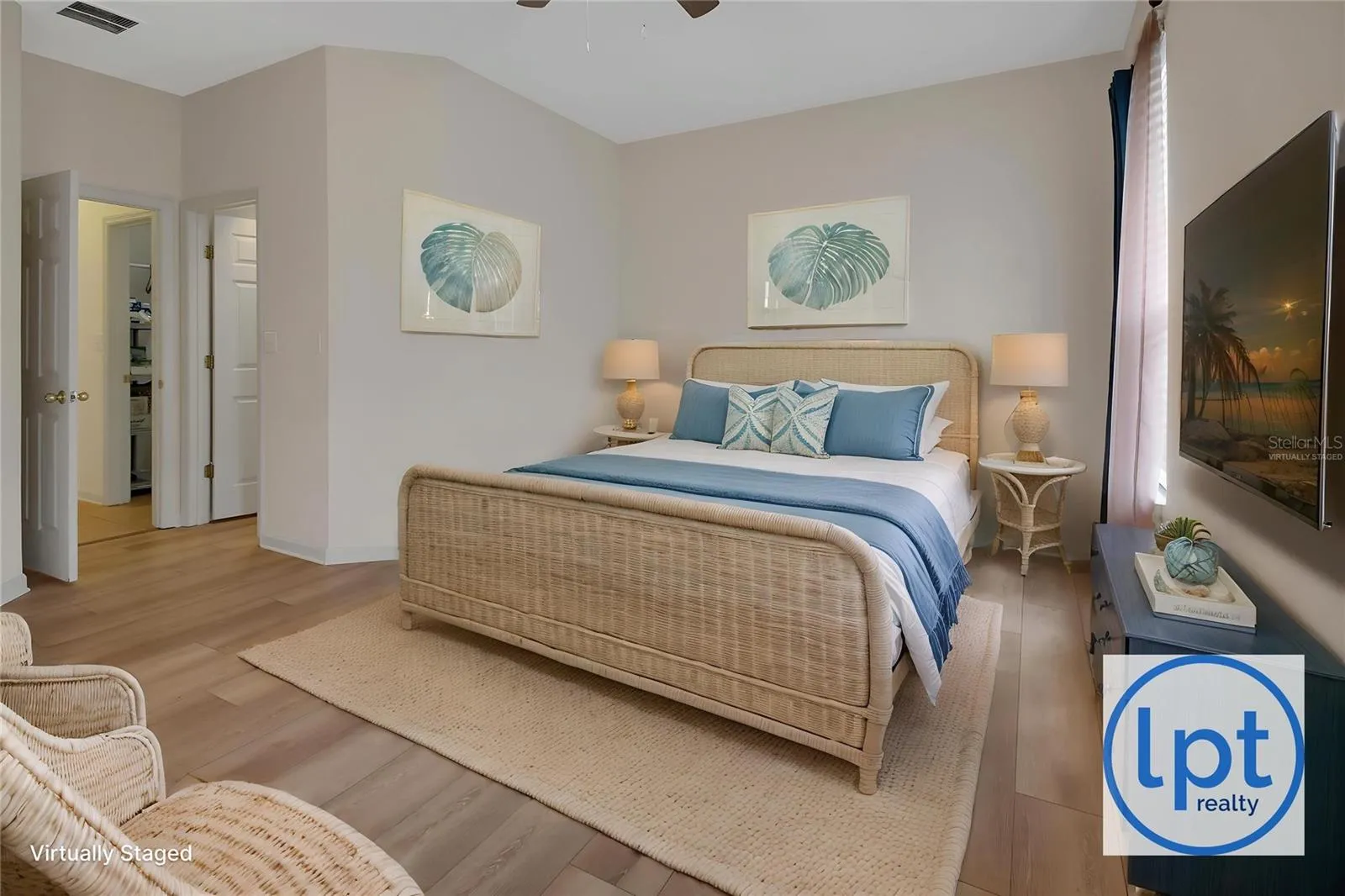 virtually staged primary bedroom from different angle