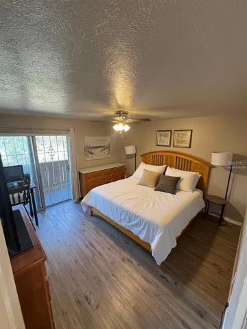 Primary bedroom, bed virtually staged