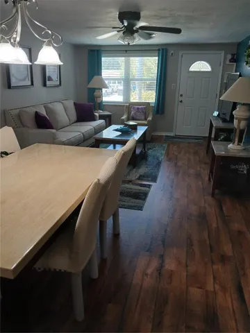 LIVING/DINING ROOM LOOKING TOWARD FRONT DOOR