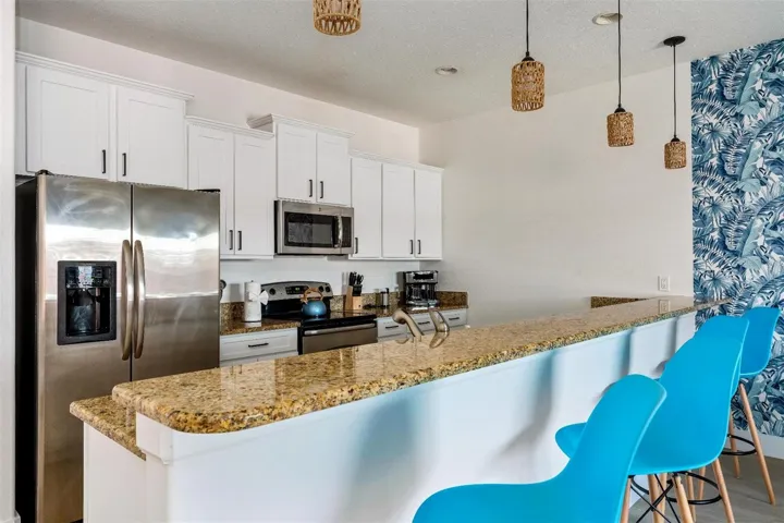 The fresh and modern interior delivers an OPEN CONCEPT layout designed for both every day living and entertaining, featuring durable LUXURY VINYL PLANK &amp; TILE FLOORING throughout, a bright and inviting living and dining area, and a well appointed kitchen overlooking it all with easy access to the outdoor living space.