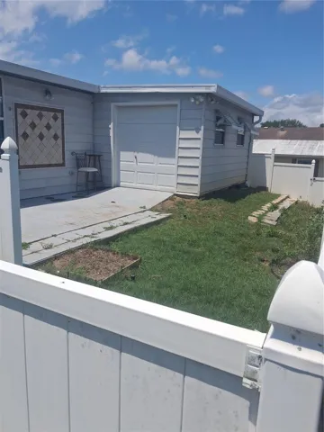 Private Fenced Area with small dog door