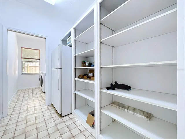 massive pantry with 2nd fridge and laundry