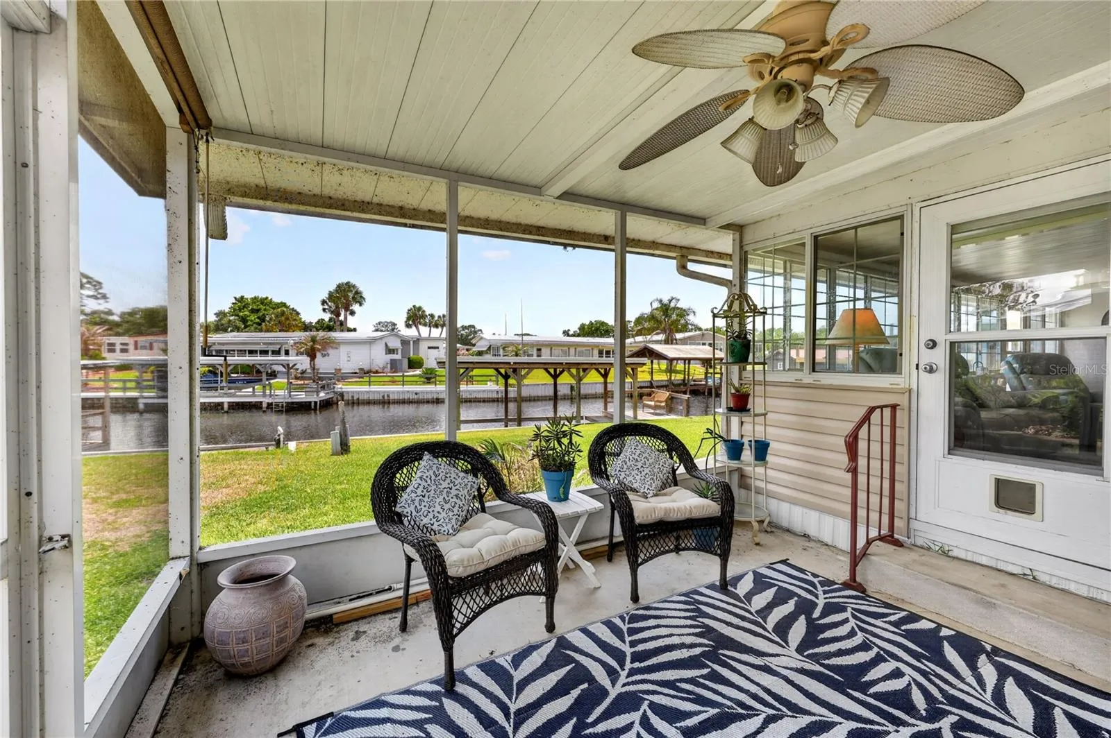 Covered screened porch with ceiling fan